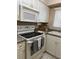 Kitchen with stove, microwave, and lots of cabinets at 1700 6Th Nw St # C27, Winter Haven, FL 33881