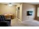 Spacious living room with TV and comfortable seating at 1700 6Th Nw St # C27, Winter Haven, FL 33881