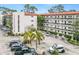 Two-story condo building with surrounding parking at 200 El Camino Dr # 309, Winter Haven, FL 33884
