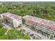 Condo building showcasing multiple units and parking at 200 El Camino Dr # 309, Winter Haven, FL 33884