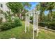 Landscaped backyard with arbor and pond at 200 El Camino Dr # 309, Winter Haven, FL 33884