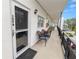 Private balcony with seating and building view at 200 El Camino Dr # 309, Winter Haven, FL 33884