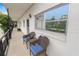 Shared balcony with seating area and exterior view at 200 El Camino Dr # 309, Winter Haven, FL 33884
