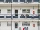 Apartment building balcony with seating and exterior view at 200 El Camino Dr # 309, Winter Haven, FL 33884