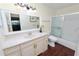 Bathroom with vanity, toilet, shower/tub combo, and wood floor at 200 El Camino Dr # 309, Winter Haven, FL 33884