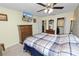 Bedroom with double bed, dresser, and ceiling fan at 200 El Camino Dr # 309, Winter Haven, FL 33884