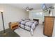Bedroom with double bed, nightstand, dresser, and ceiling fan at 200 El Camino Dr # 309, Winter Haven, FL 33884