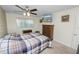 Bedroom with double bed, dresser, and ceiling fan at 200 El Camino Dr # 309, Winter Haven, FL 33884