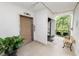 Building hallway with elevator, stairs, and seating at 200 El Camino Dr # 309, Winter Haven, FL 33884