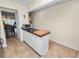 Kitchen features a breakfast bar and dark countertops at 200 El Camino Dr # 309, Winter Haven, FL 33884