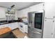 Updated kitchen with stainless steel appliances and white cabinets at 200 El Camino Dr # 309, Winter Haven, FL 33884