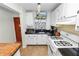White kitchen with granite countertops and gas stove at 200 El Camino Dr # 309, Winter Haven, FL 33884