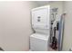 Laundry room with stackable washer and dryer at 200 El Camino Dr # 309, Winter Haven, FL 33884