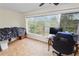 Bright office space with large window and view, featuring a desk and chair at 200 El Camino Dr # 309, Winter Haven, FL 33884