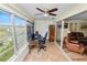 Sunroom features a desk and offers a view of nature at 200 El Camino Dr # 309, Winter Haven, FL 33884