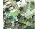 Aerial view of a land plot, indicating property boundaries, neighboring streets and utilities, and surrounding greenery at 23 Lake Hollingworth, Lakeland, FL 33803