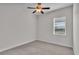 Bedroom with carpeted floor and ceiling fan with light fixture at 2424 Delphi Cir, Lakeland, FL 33812