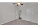 Bedroom with carpet flooring, a ceiling fan, and white trim throughout at 2424 Delphi Cir, Lakeland, FL 33812