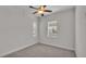 Bright bedroom with ceiling fan and neutral carpeting at 2424 Delphi Cir, Lakeland, FL 33812