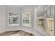 Bonus room featuring modern flooring and windows overlooking the screened pool area at 2424 Delphi Cir, Lakeland, FL 33812