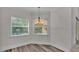 Bright kitchen nook with wood-look floors and pool view at 2424 Delphi Cir, Lakeland, FL 33812