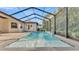 Screened pool and spa with waterfall feature and spacious deck at 2424 Delphi Cir, Lakeland, FL 33812