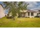 Backyard with grassy area and patio at 2507 Torrens Dr, Lakeland, FL 33805