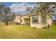 Backyard with grassy area and patio at 2507 Torrens Dr, Lakeland, FL 33805