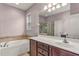 Bathroom with double vanity, soaking tub, and shower at 2507 Torrens Dr, Lakeland, FL 33805