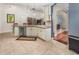 Kitchen with an island, white cabinets, and stainless steel dishwasher at 2507 Torrens Dr, Lakeland, FL 33805