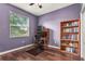 Home office with built-in shelving and hardwood floors at 2507 Torrens Dr, Lakeland, FL 33805