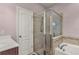 Walk-in shower with tile surround at 2507 Torrens Dr, Lakeland, FL 33805