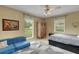 Spacious bedroom with blue couch and large windows at 2620 Jonila Ave, Lakeland, FL 33803