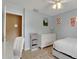 Bright bedroom with white dresser and access to hallway at 2620 Jonila Ave, Lakeland, FL 33803