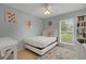 Cozy bedroom featuring a white bed frame and built-in shelving at 2620 Jonila Ave, Lakeland, FL 33803