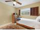 Charming bedroom with wooden bed and dresser at 2620 Jonila Ave, Lakeland, FL 33803