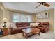 Relaxing Gathering room with brown leather sectional sofa at 2620 Jonila Ave, Lakeland, FL 33803