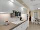 Modern kitchen features white cabinets, granite countertops, and built-in microwave at 2620 Jonila Ave, Lakeland, FL 33803