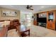 Spacious living room featuring a leather sectional sofa and built-in entertainment center at 2620 Jonila Ave, Lakeland, FL 33803