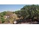 Overhead view of a neighborhood with mature trees, houses, and spacious lots, showcasing the serene environment at 3016 Hutchins St, Eaton Park, FL 33840