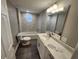 Updated bathroom features a tiled shower and a modern vanity at 3016 Hutchins St, Eaton Park, FL 33840