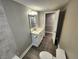 Bathroom featuring updated vanity, toilet, and access to the shower and rest of the home at 3016 Hutchins St, Eaton Park, FL 33840