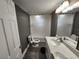 Bathroom with white vanity and marble countertop at 3016 Hutchins St, Eaton Park, FL 33840