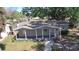 Inviting single-story home with a covered front porch and well-maintained lawn at 3016 Hutchins St, Eaton Park, FL 33840