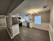 Well-lit kitchen with stainless steel appliances, white cabinets, and an adjacent dining area at 3016 Hutchins St, Eaton Park, FL 33840