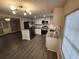 Modern kitchen with stainless steel appliances, granite countertops, and new cabinets at 3016 Hutchins St, Eaton Park, FL 33840