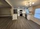 Modern kitchen with white cabinetry, stainless steel appliances, and open floor plan at 3016 Hutchins St, Eaton Park, FL 33840