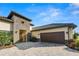 Luxury home with stone accents and a paver driveway at 3131 Sanctuary Cir, Lakeland, FL 33803