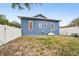 Blue house with small backyard and propane tank at 360 N Lake Shore Way, Lake Alfred, FL 33850