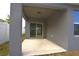 Covered back patio with sliding glass doors leading to the backyard at 3648 Julius Estates Blvd, Winter Haven, FL 33881